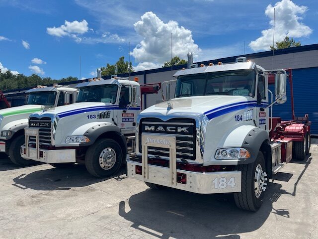 Envirowaste roll-off truck and fleet at the Live Oak Florida headquarters yard