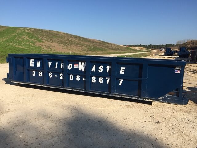 Envirowaste roll-off dumpster delivered on a residential driveway in North Florida